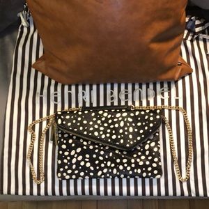 Henri Bendel black with white spots calf hair cross body and clutch!